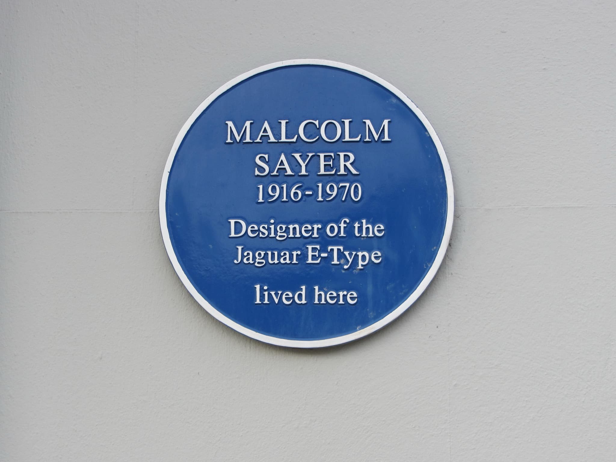 A round blue plaque reading Malcolm Sayer 1916-1970, Designer of the Jaguar E-Type, lived here. Opens a larger view