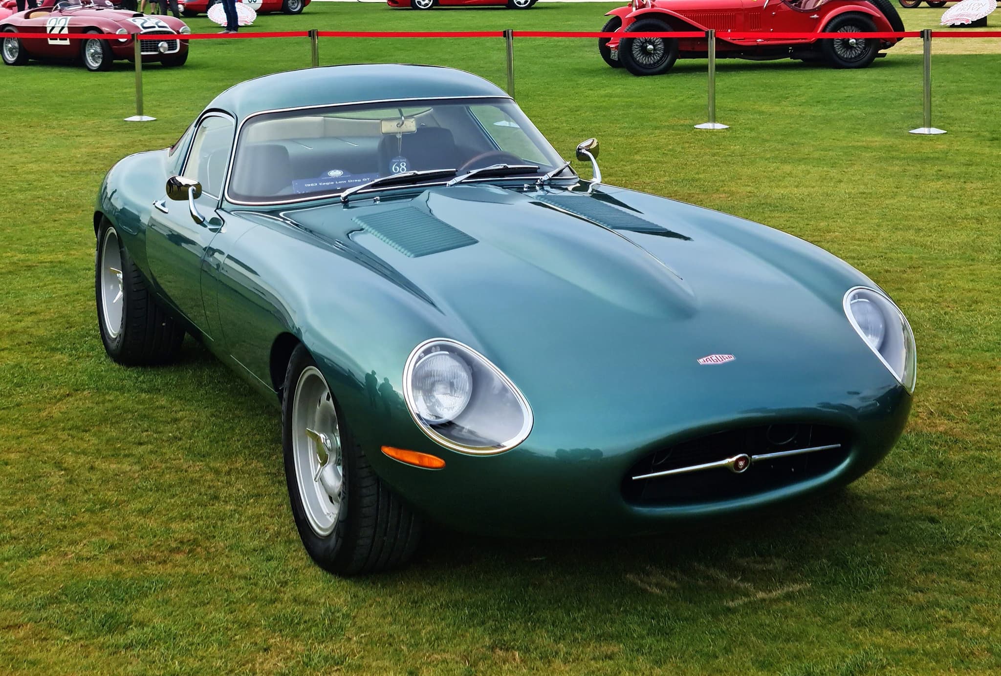 A green Eagle Low Drag GT fastback without bumpers on a concours lawn.